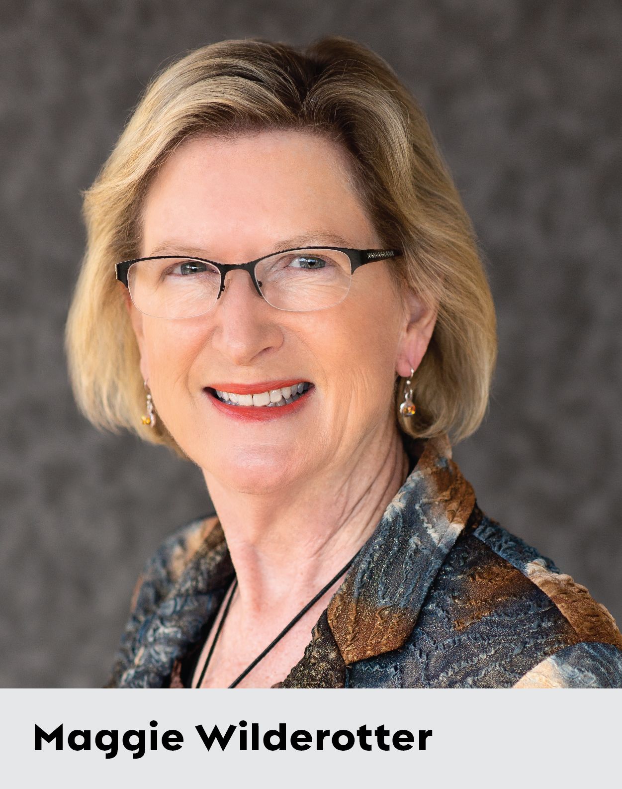 Headshot of Maggie Wilderotter with name label