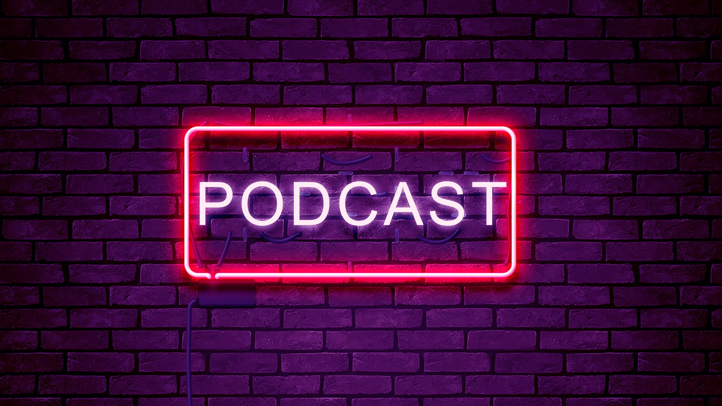 Una foto di un'insegna al neon su un muro di mattoni con la scritta "podcast."