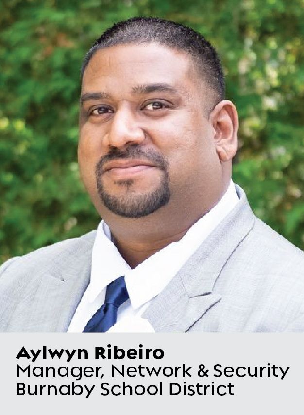 Foto in primo piano di Aylwyn Ribeiro, responsabile della rete e della sicurezza presso il distretto scolastico di Burnaby