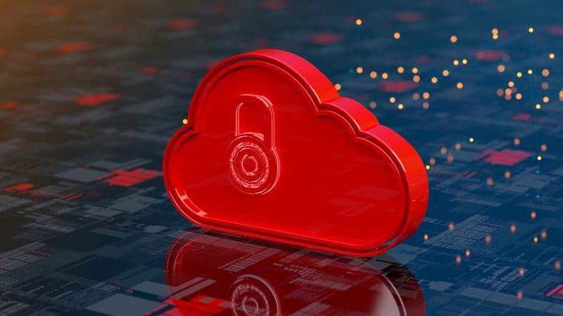 A bright red plastic disc in the shape of a cloud sits atop a computer console.